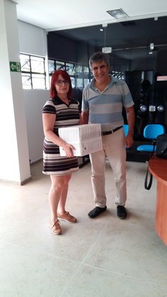 Arquivista Geane de Luna Souto e o Prof. Dr. Ângelo Pessoa A Servidora e Arquivista do Arquivo Central, Geane de Luna Souto realiza o recebimento da documentação